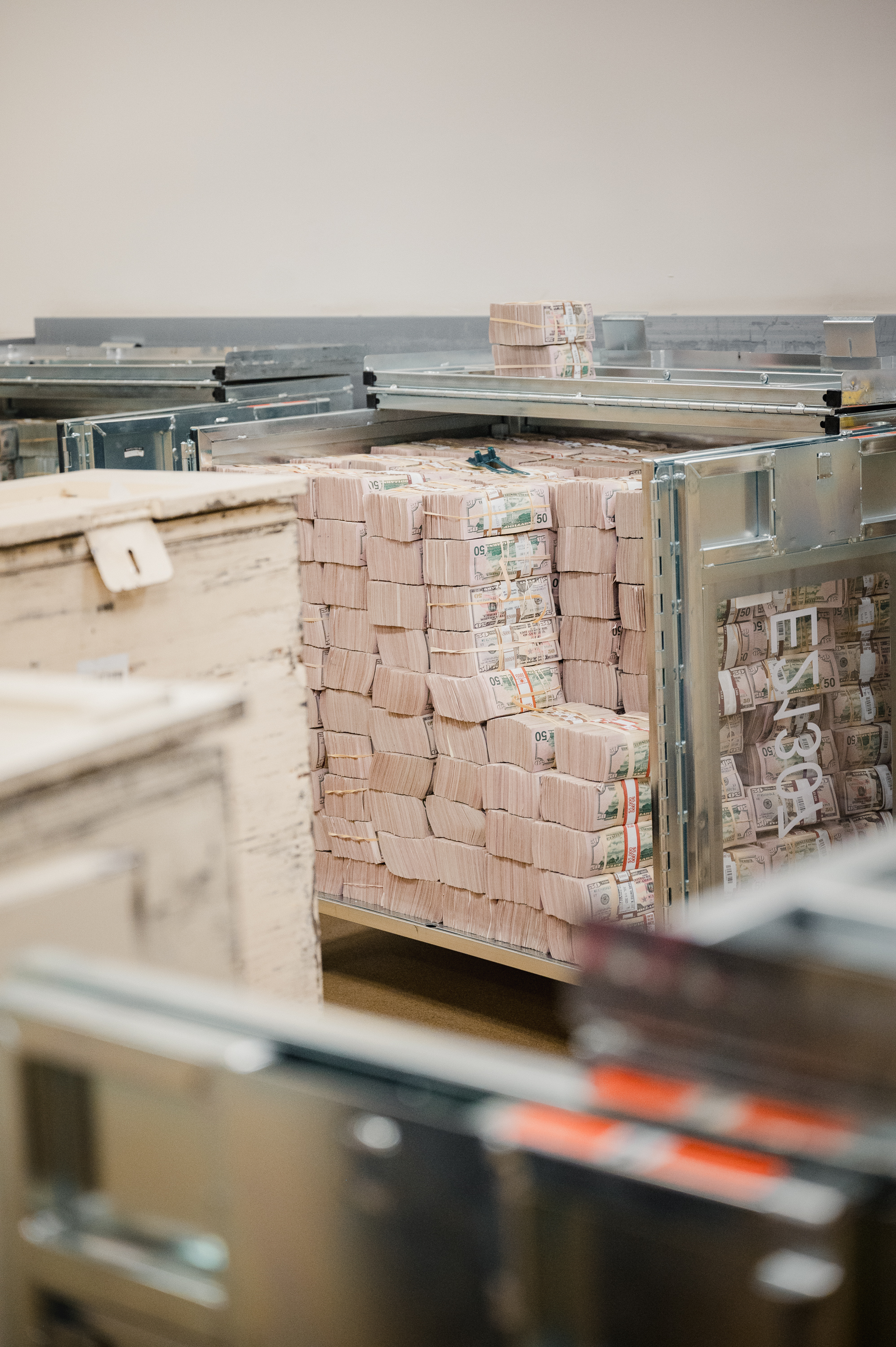 BALTIMORE, MD - JULY 12, 2023: Currency sit in a container at The Federal Reserve Bank of Richmond in Baltimore, MD. on Wednesday, July 12, 2023.(Photo by Hannah Yoon for The Washington Post)